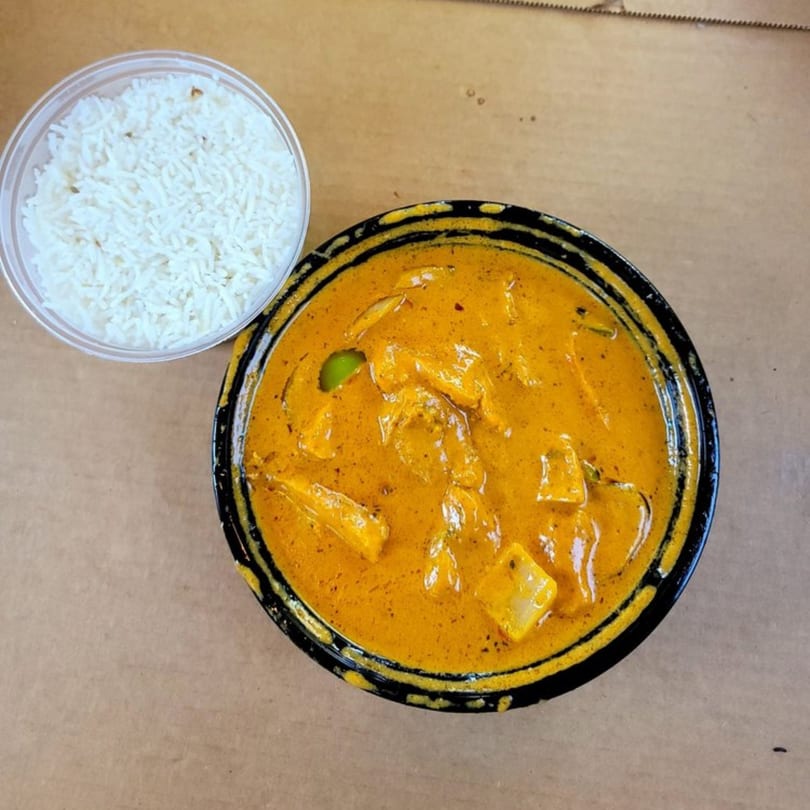 Overhead view of Indian chicken curry and rice from Curry Place Germantown.